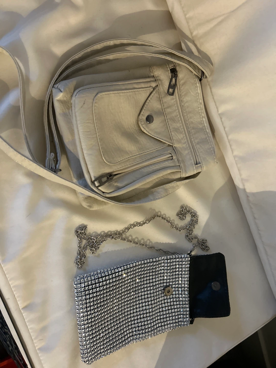 Two Purses: Beige Crossbody & Silver Clutch