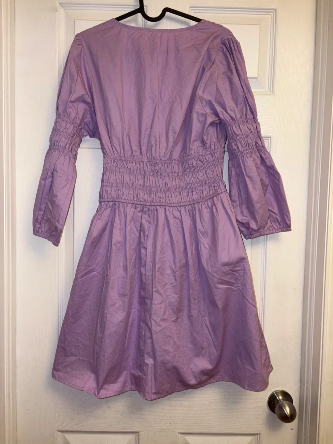 New lavender V-neck dress with smocked detailing on the sleeves image indicator(3)