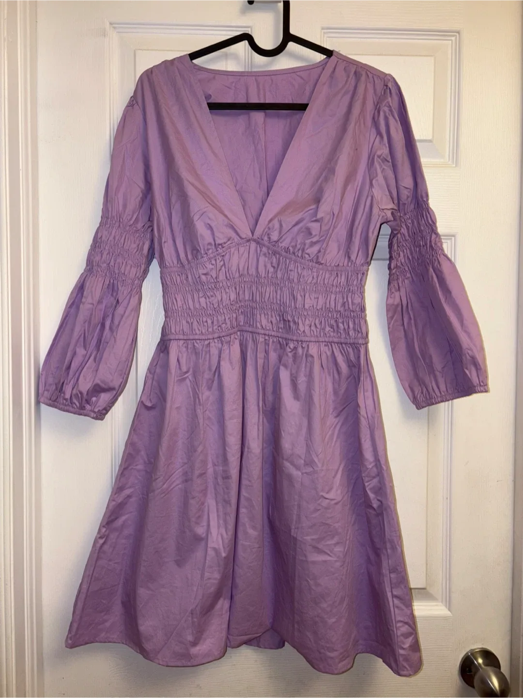 New lavender V-neck dress with smocked detailing on the sleeves image indicator(2)