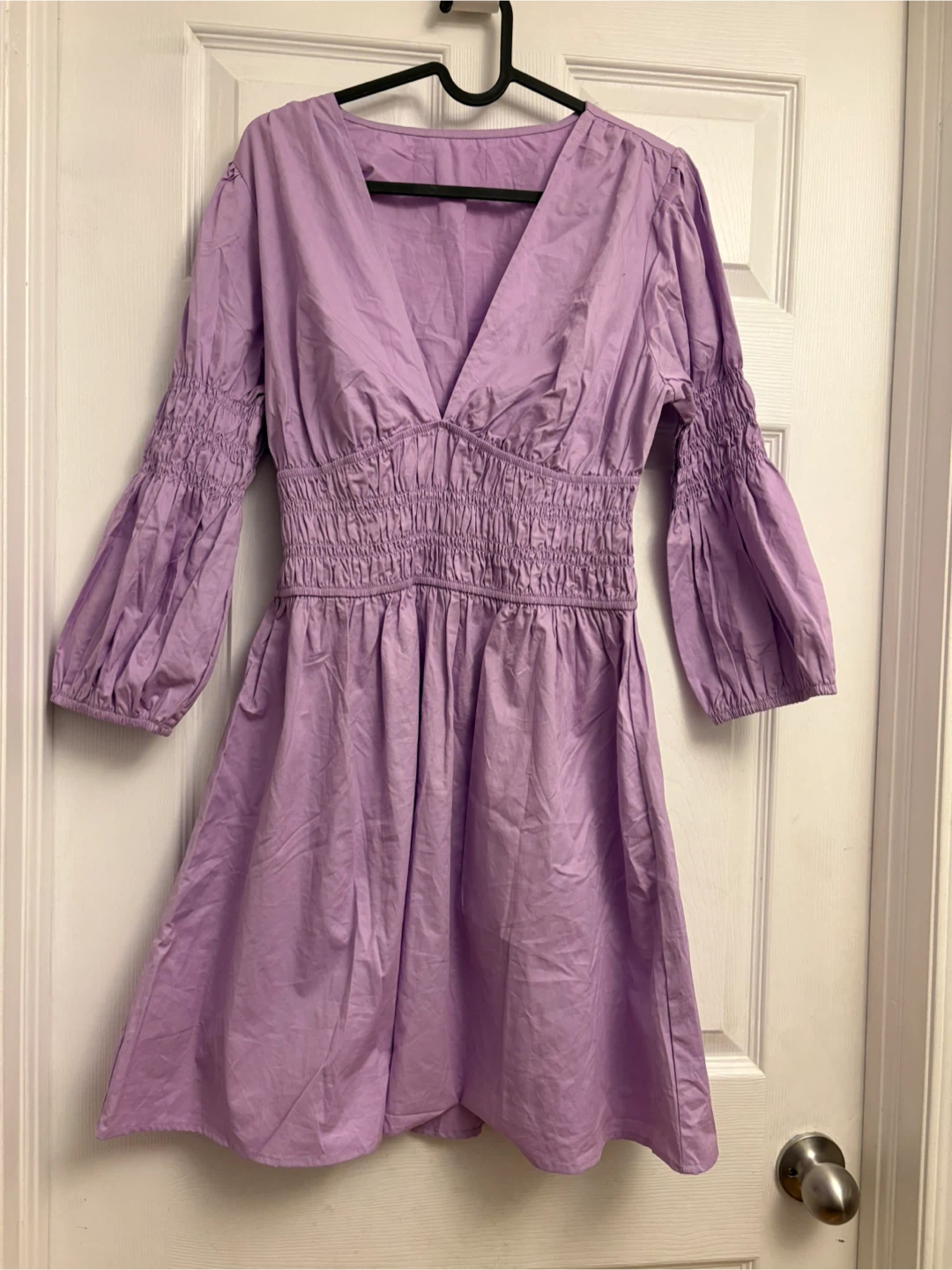New lavender V-neck dress with smocked detailing on the sleeves