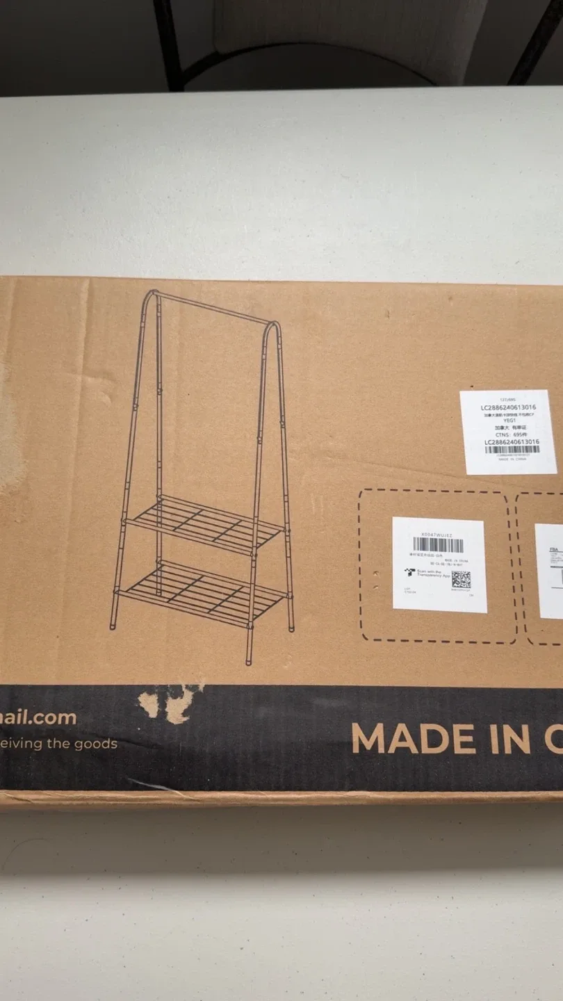 White colored clothing rack with shelves image indicator(2)