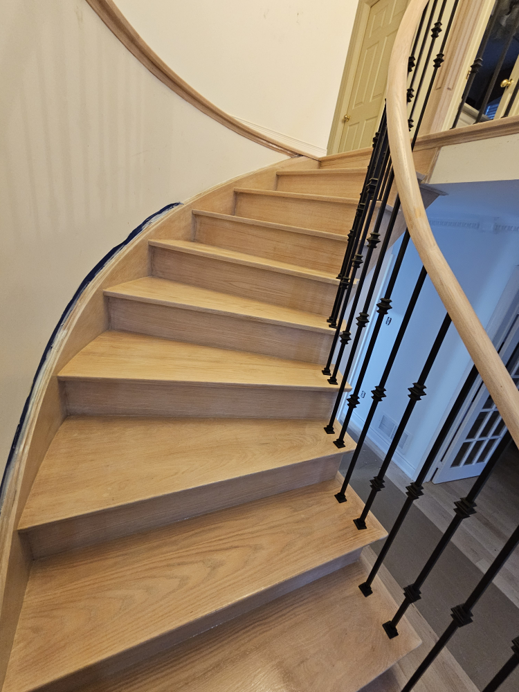 Custom Staircase with Wrought Iron Railing