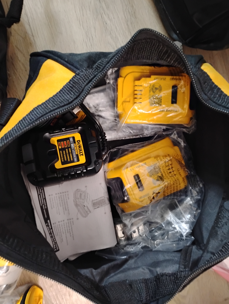 bag of brand new drills battery and charger - photo 3
