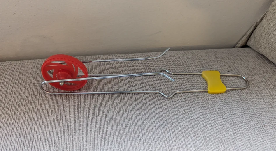 Vintage Red Plastic Wheel Toy thumbnail