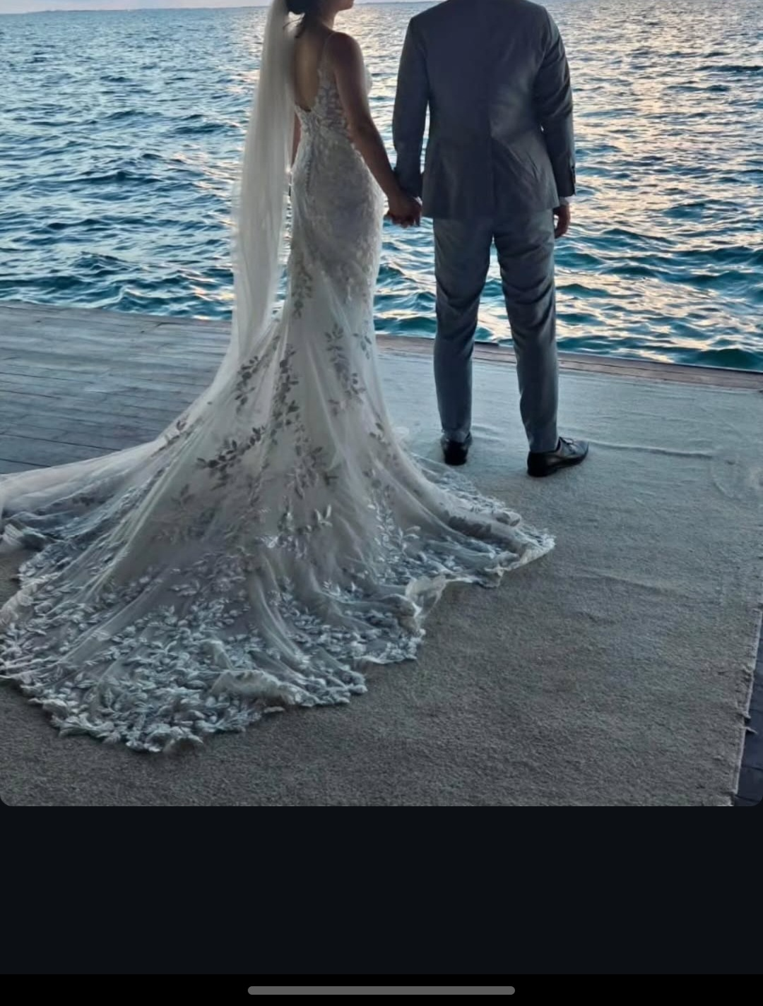 Lace wedding dress with detailed train