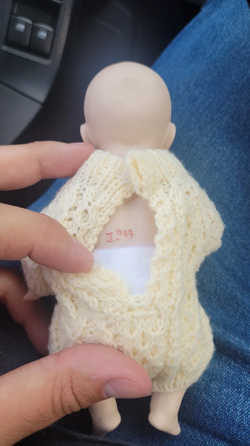 Vintage Porcelain Doll in Knitted Outfit image indicator(2)