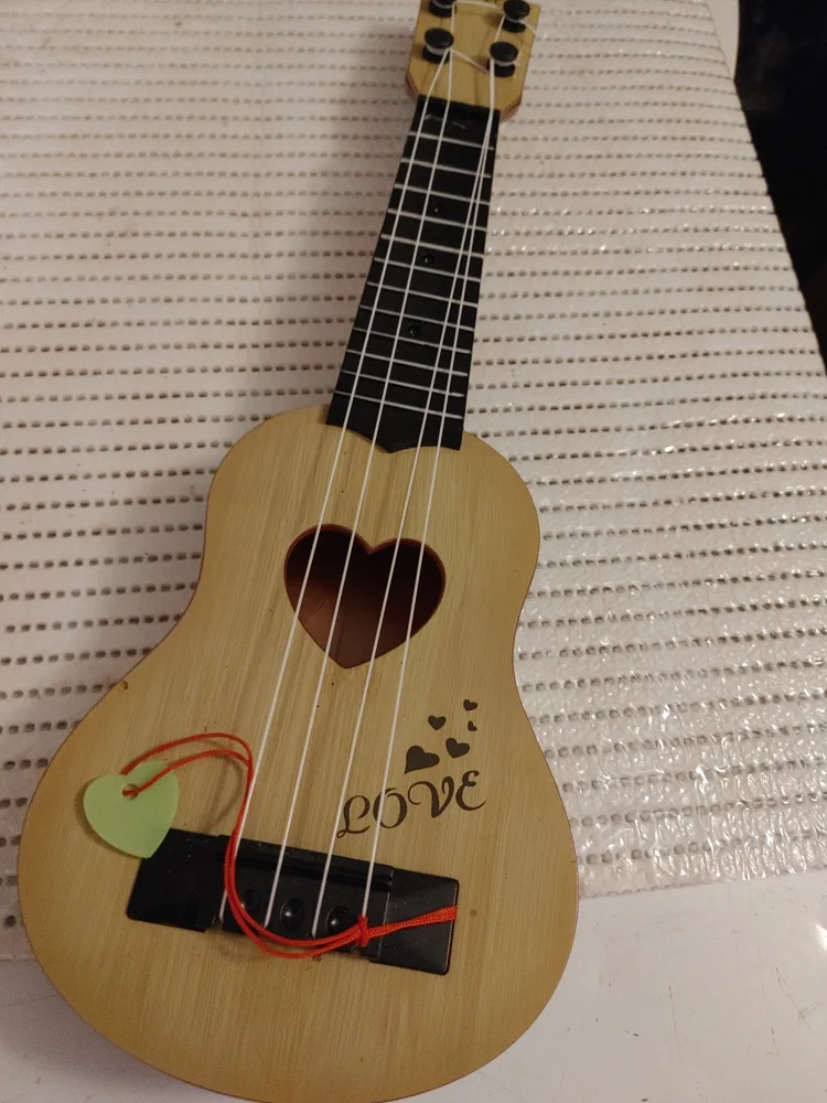 Wooden Toy Ukulele with Heart Design thumbnail