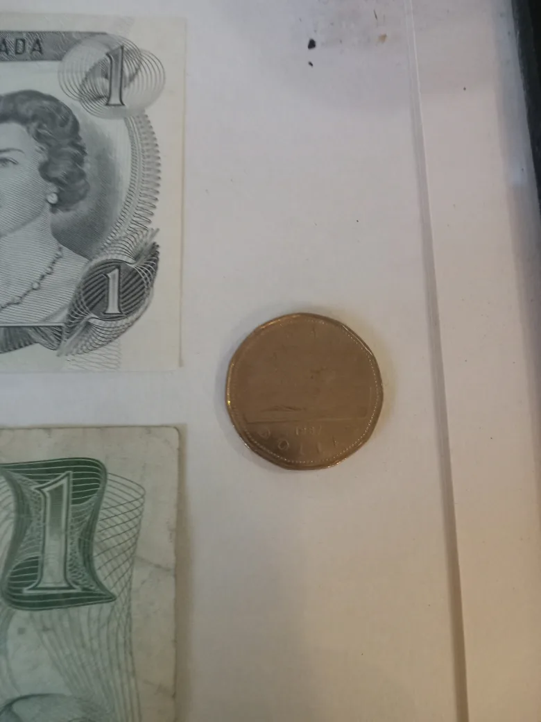 Framed Canadian One Dollar Bills & Coin image indicator(4)