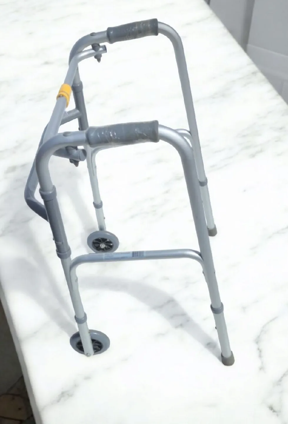 Deluxe Two Button Folding Walker with 5" Wheels thumbnail
