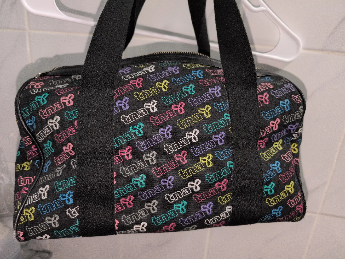 TNA black and colourful logo print bag image indicator(2)