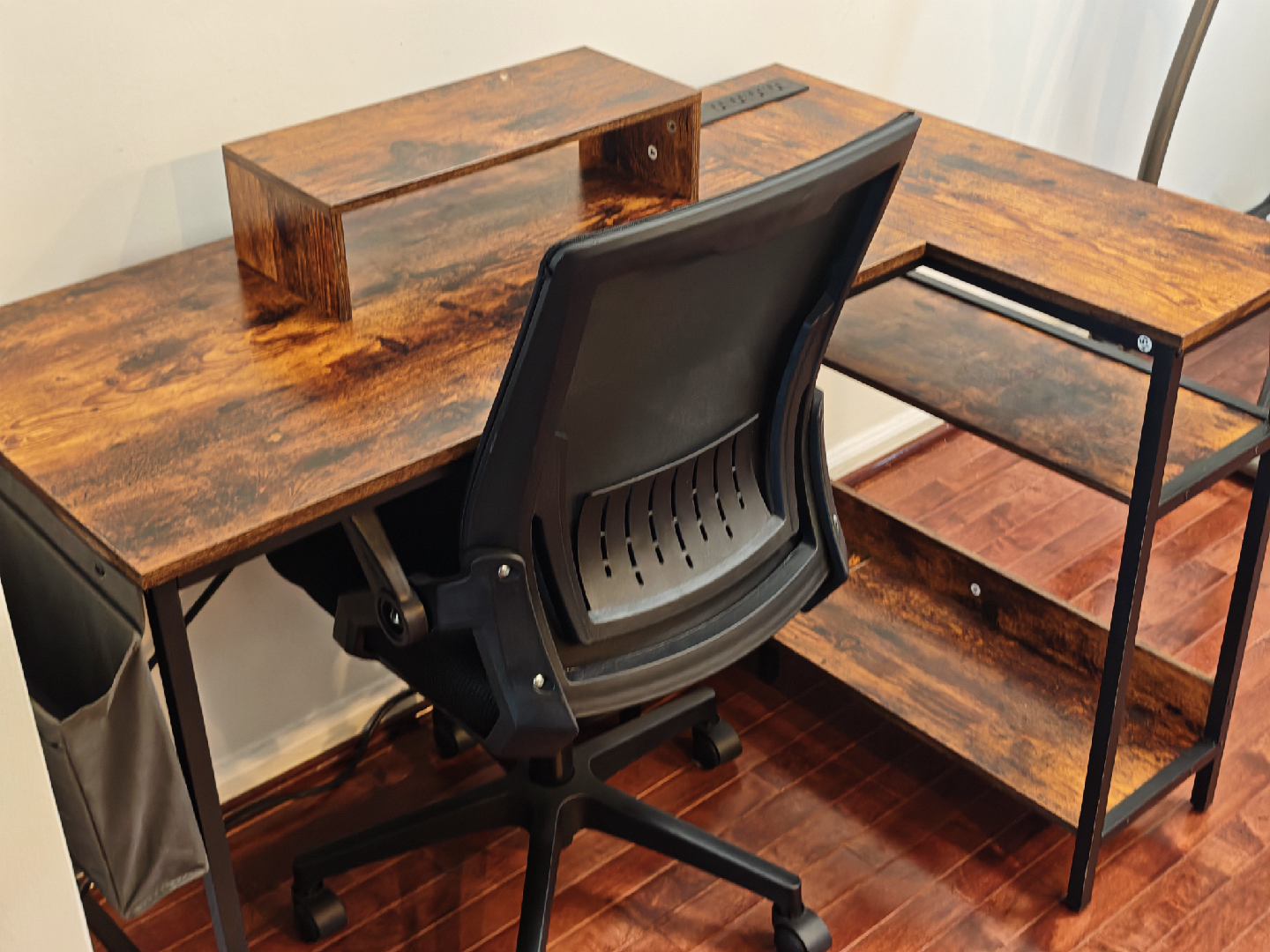 L-Shaped Brown Wood Desk with Black Chair