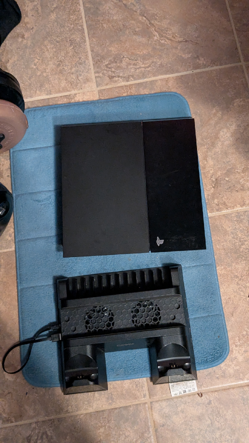 PlayStation 4 Console with cooling stand.