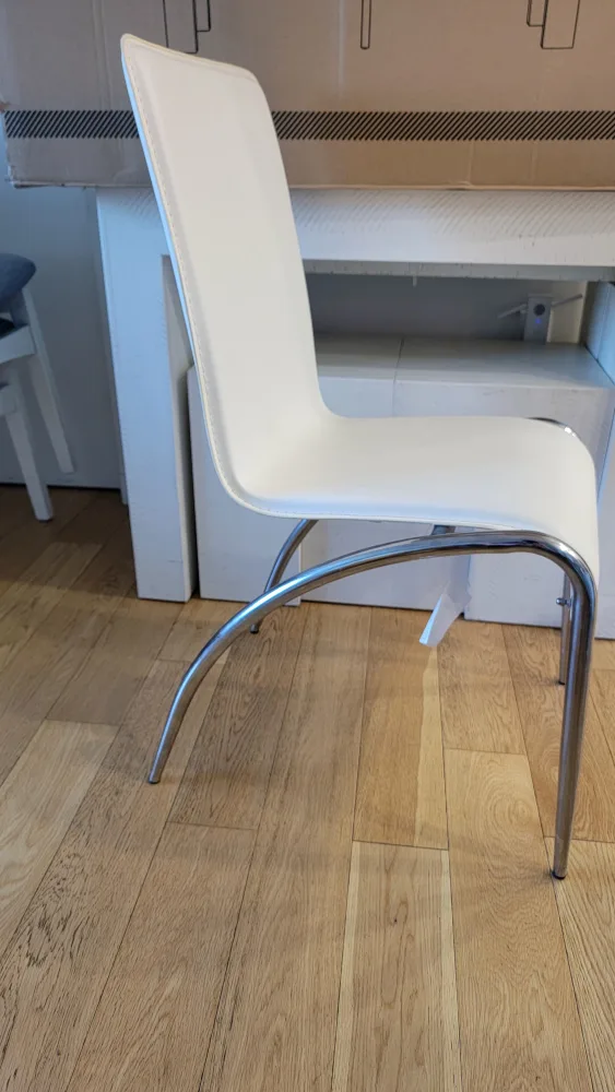 4 White Dining Chairs with Gray Covers image indicator(7)