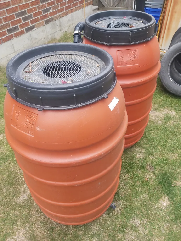 Two Orange Plastic Rain Barrels image indicator(4)