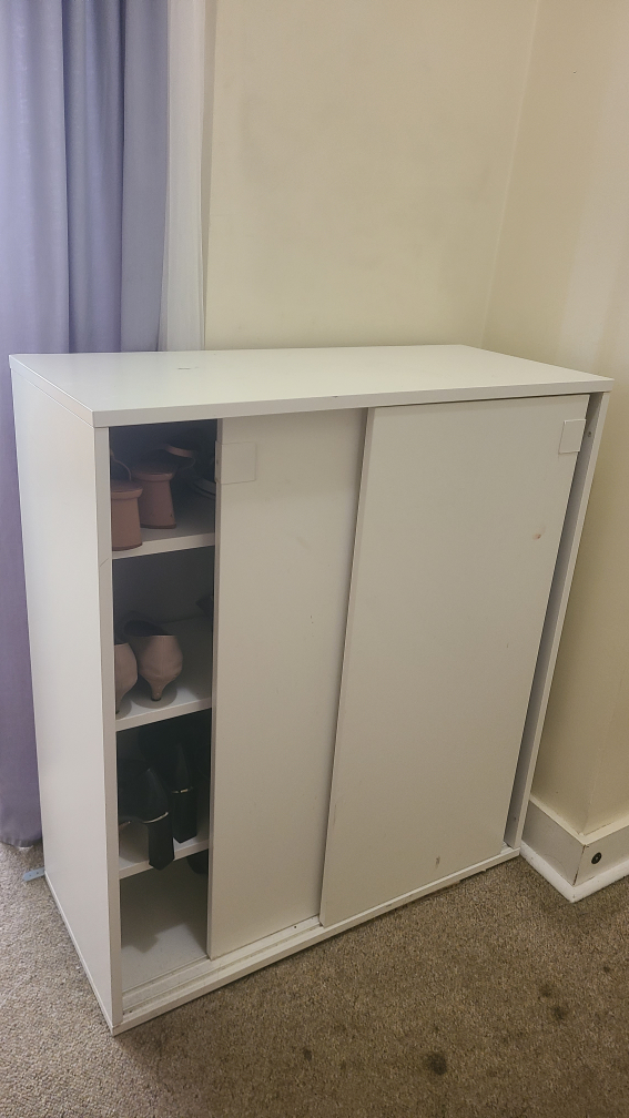 IKEA White Shoe Cabinet with Sliding Doors