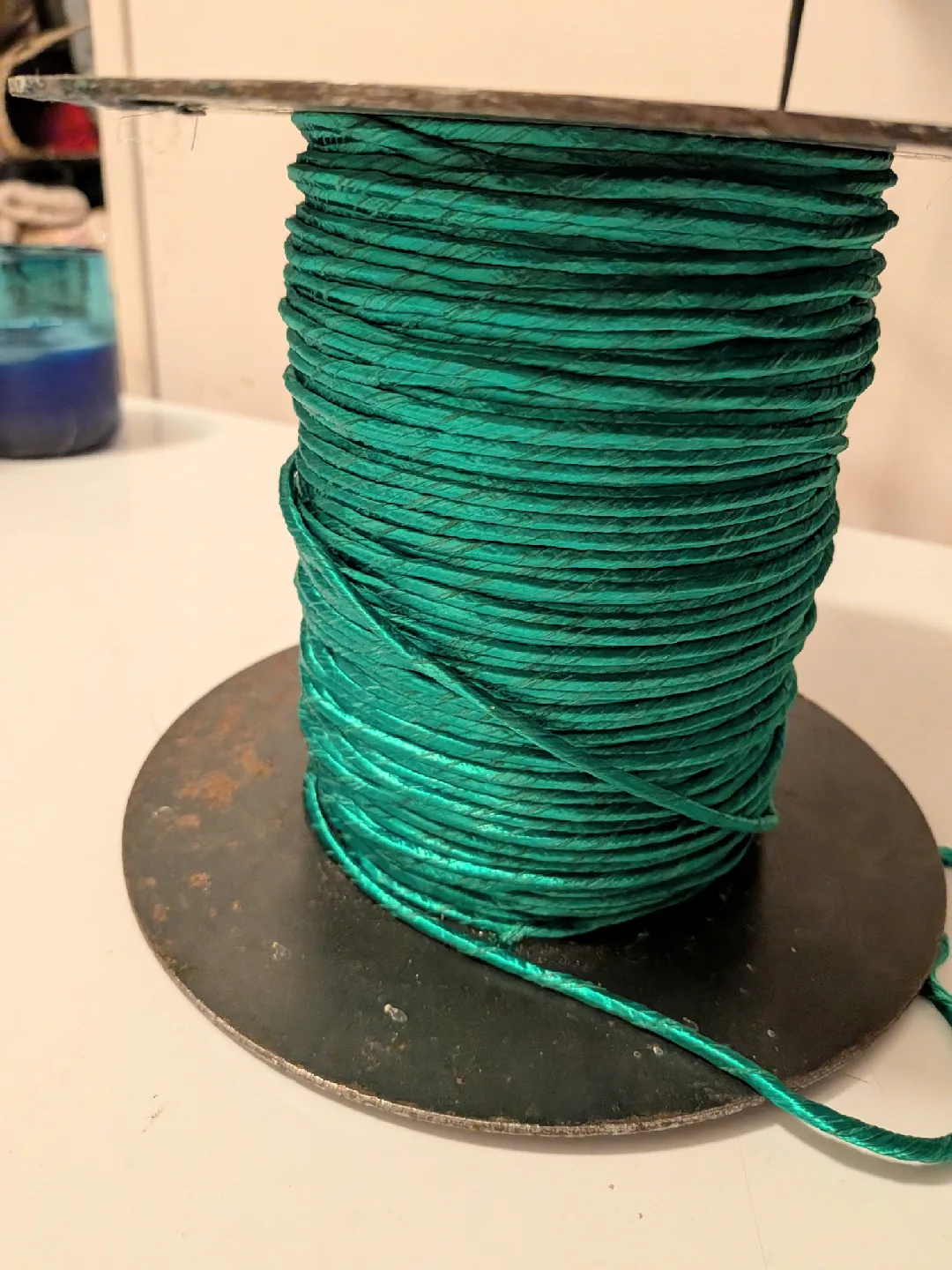 Vtg Green threaded Raffia Ribbon on large metal spool 8" x 6" thumbnail
