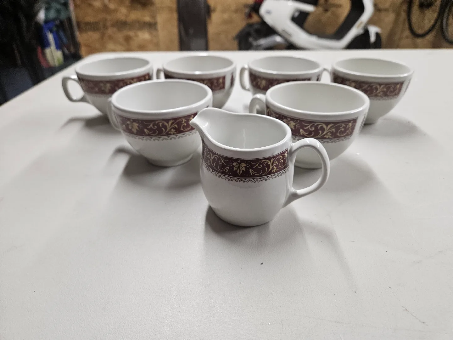 6 Steelite International Tea Cups and a Creamer.