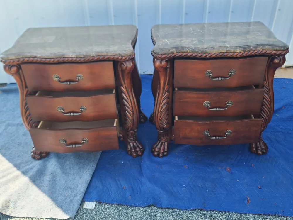 PAIR OF ASHLEY FURNITURE CARVED NIGHTSTANDS WITH MARBLE TOP image indicator(2)