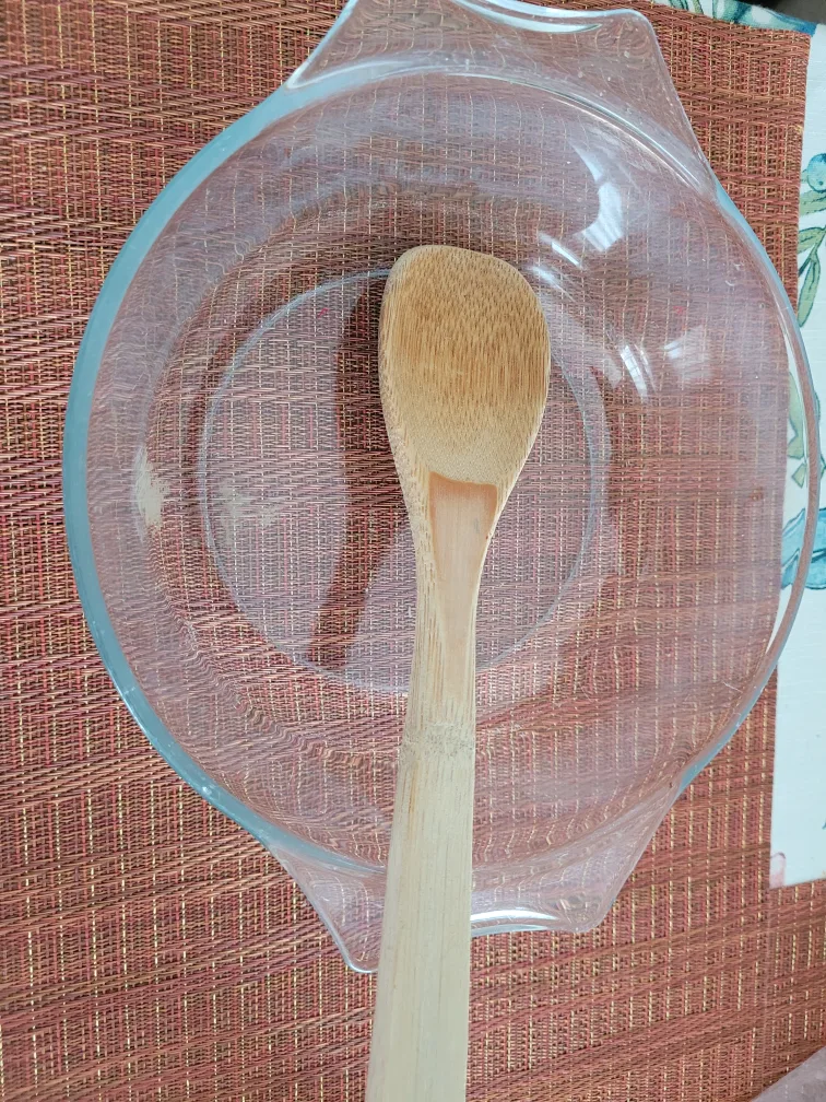 Pyrex bowl with wooden spoon thumbnail