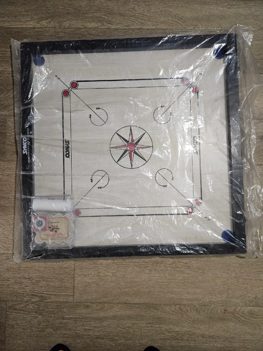 Carrom board with coins striker thumbnail