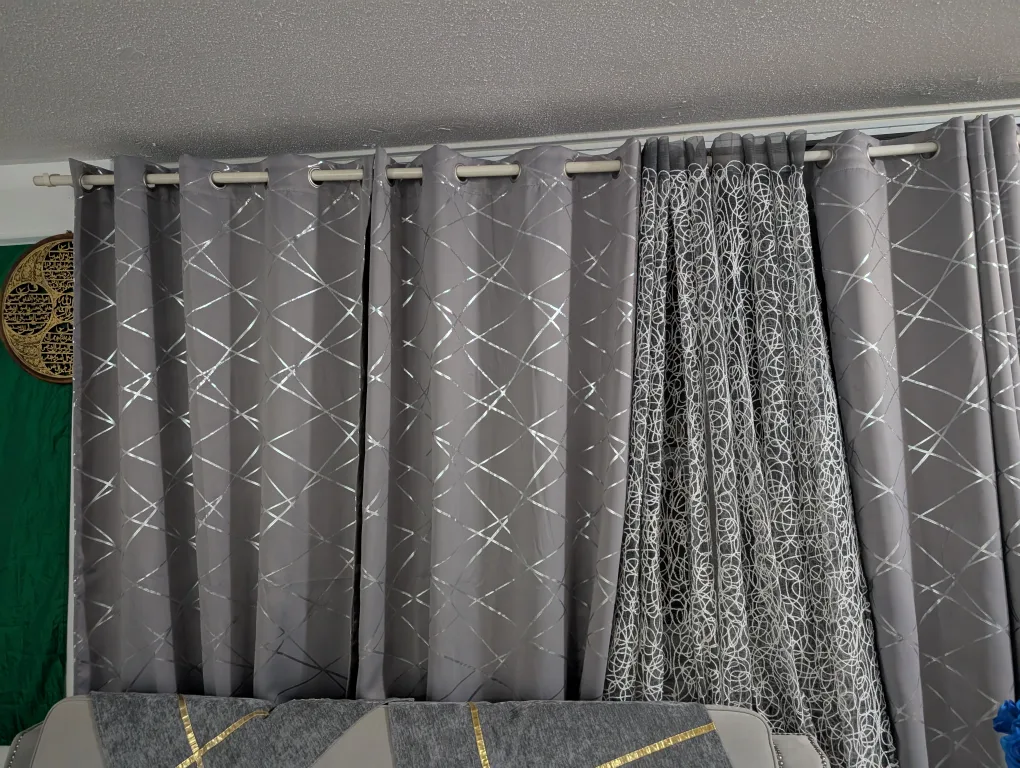 Home Decor Items: Rug, Curtains, and Coffee Table image indicator(2)