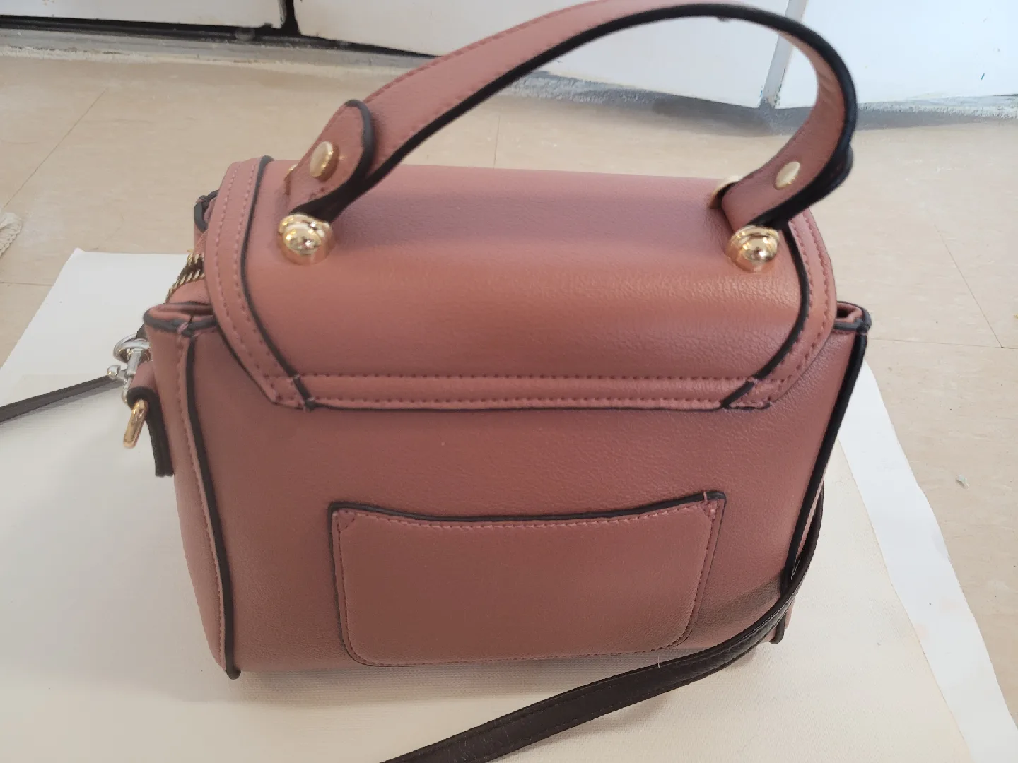 Brown Handbag with Gold Accents image indicator(3)