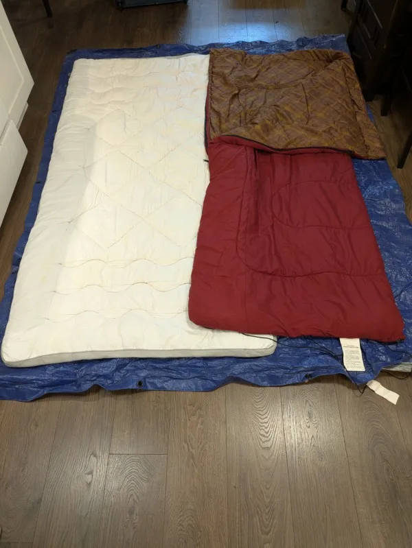 Coleman sleeping bag w/tarp & mattress pad