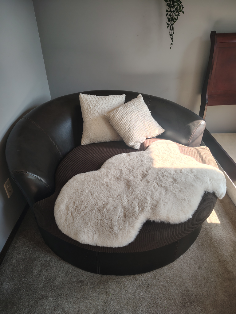 Round Accent Chair with Pillows and Faux Sheepskin Rug