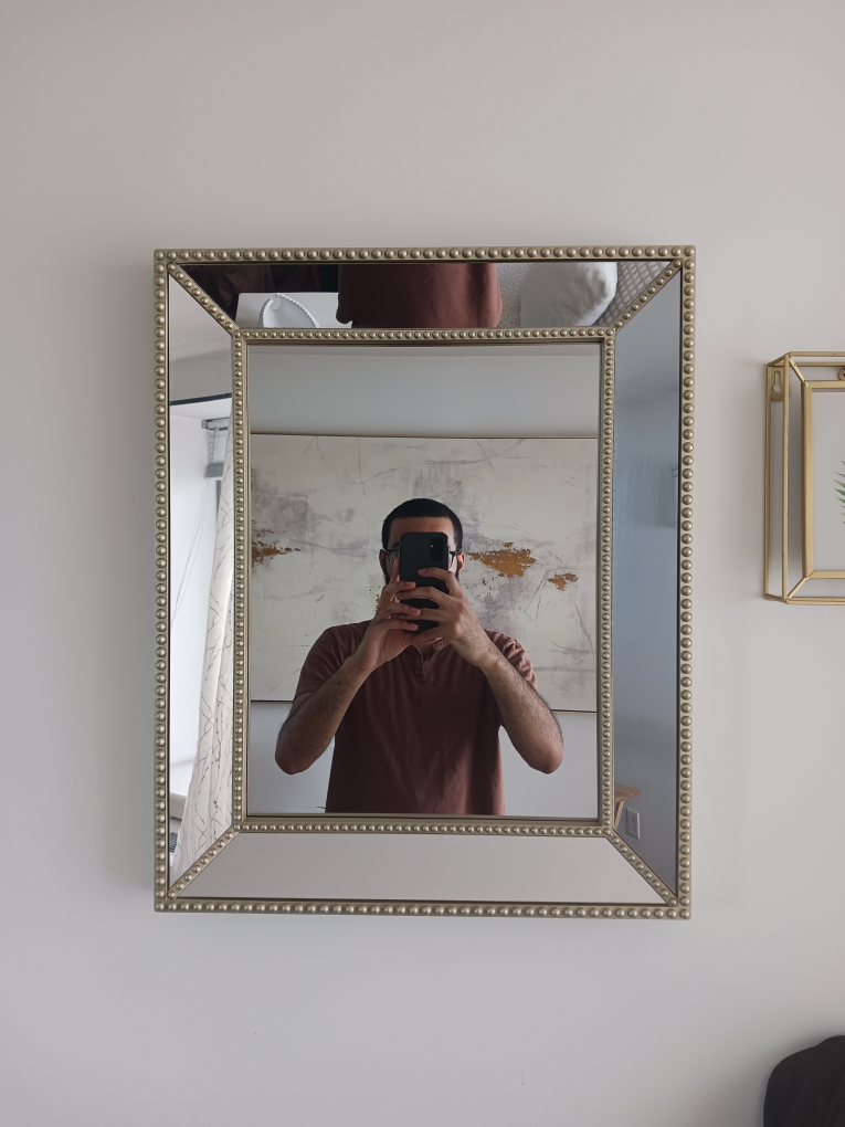 Elegant Beveled Wall Mirror with Decorative Studded Frame