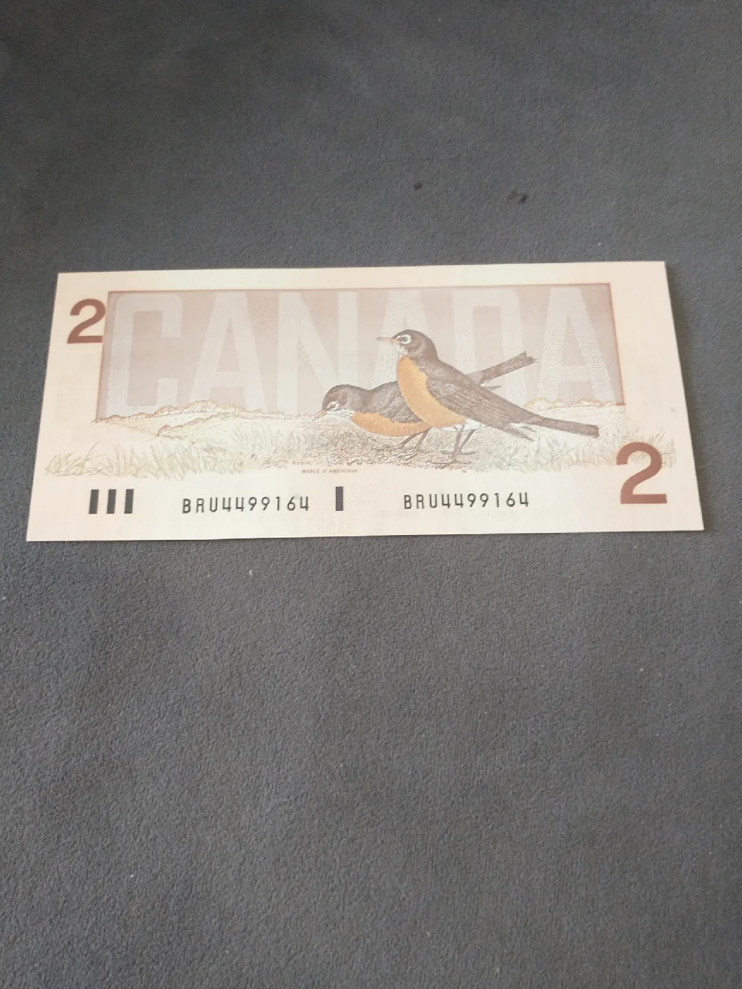 Crisp 1986 Canada GGT/JWC uncirculated $2 banknote serial 9164 image indicator(2)