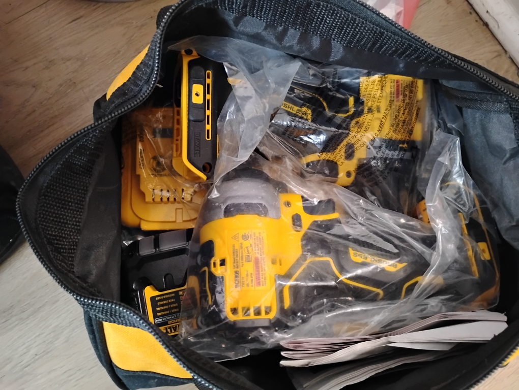 bag of brand new drills battery and charger - photo 2
