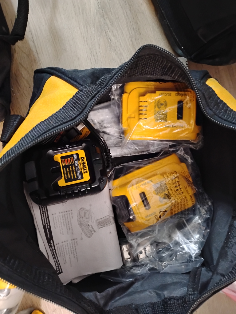 bag of brand new drills battery and charger - photo 4