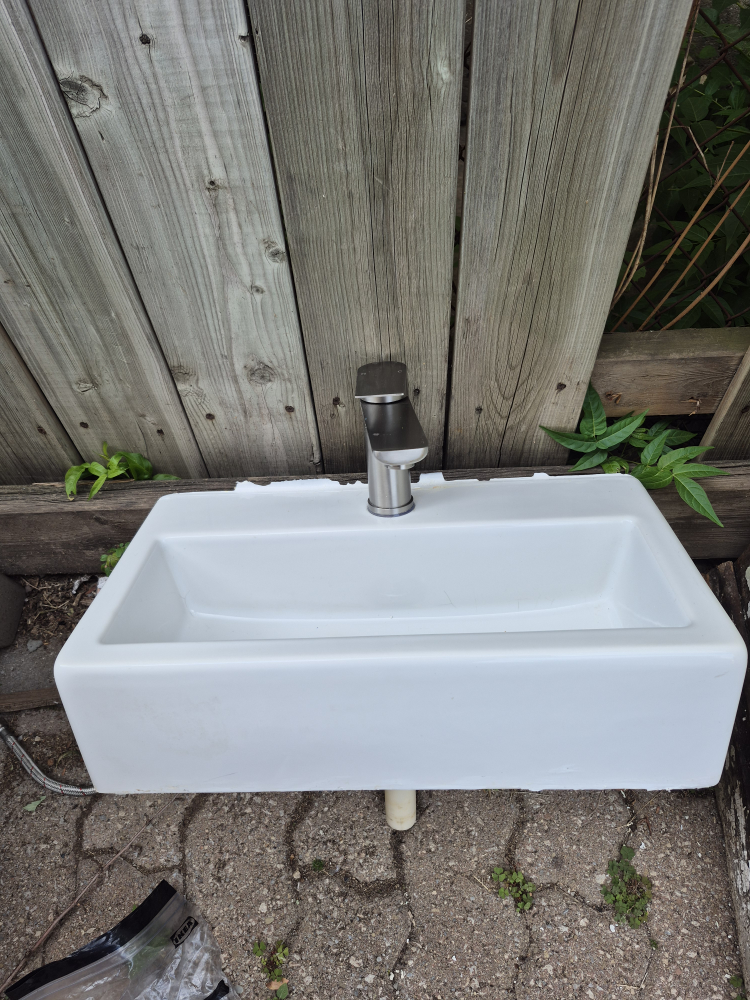 White bathroom sink with faucet