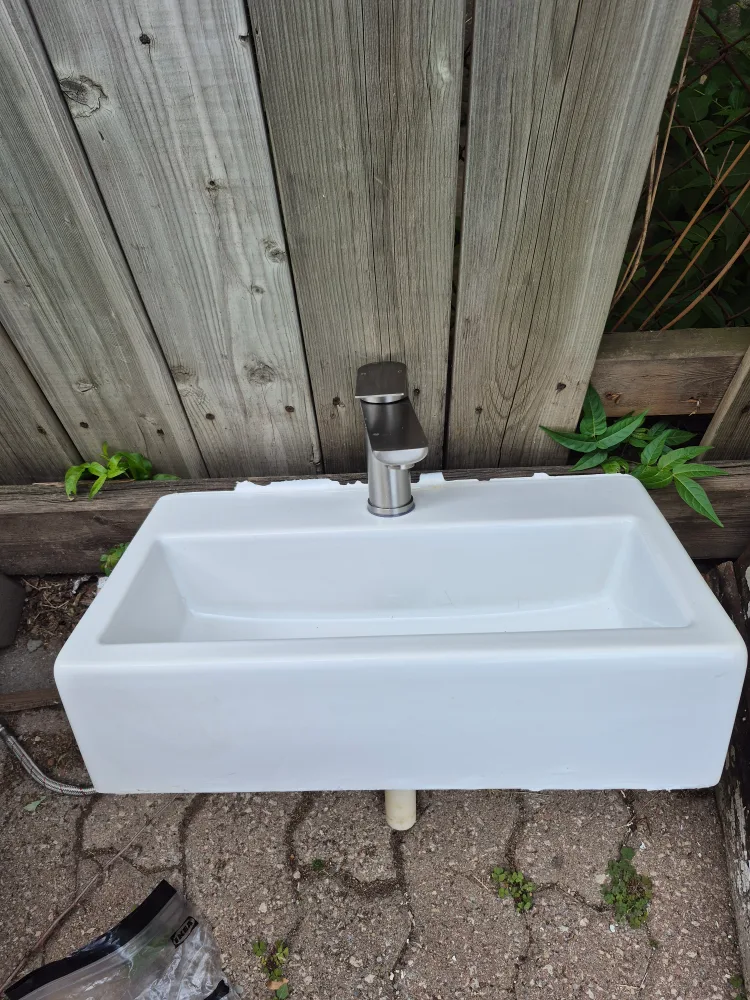 White bathroom sink with faucet thumbnail