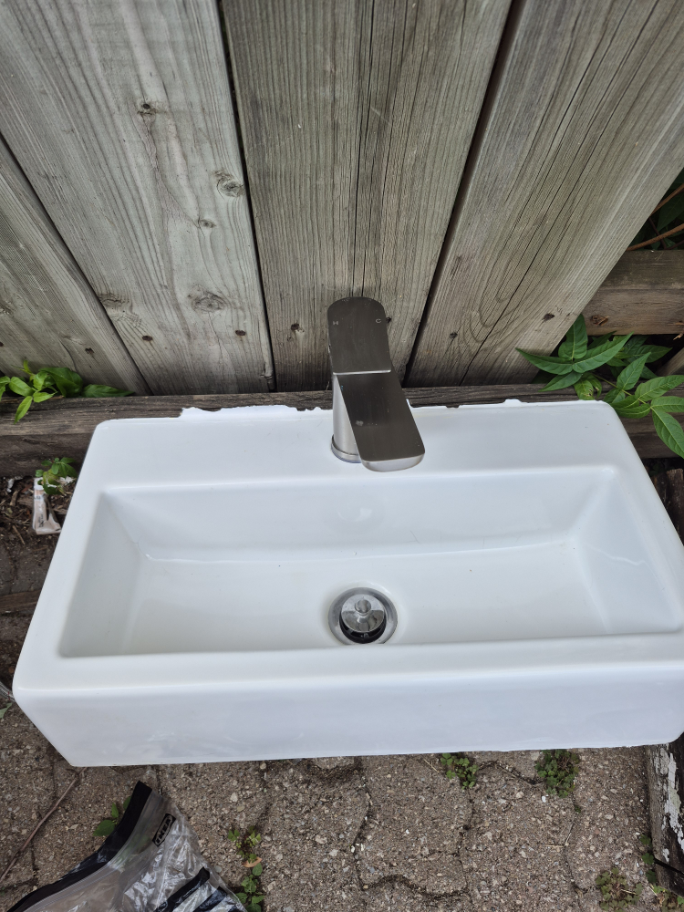 White bathroom sink with faucet - photo 2