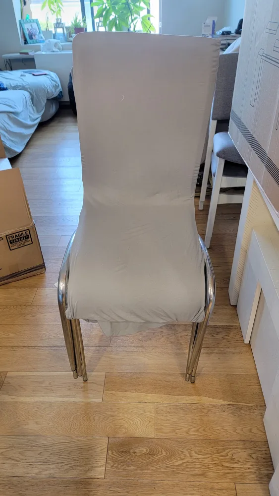 4 White Dining Chairs with Gray Covers image indicator(4)