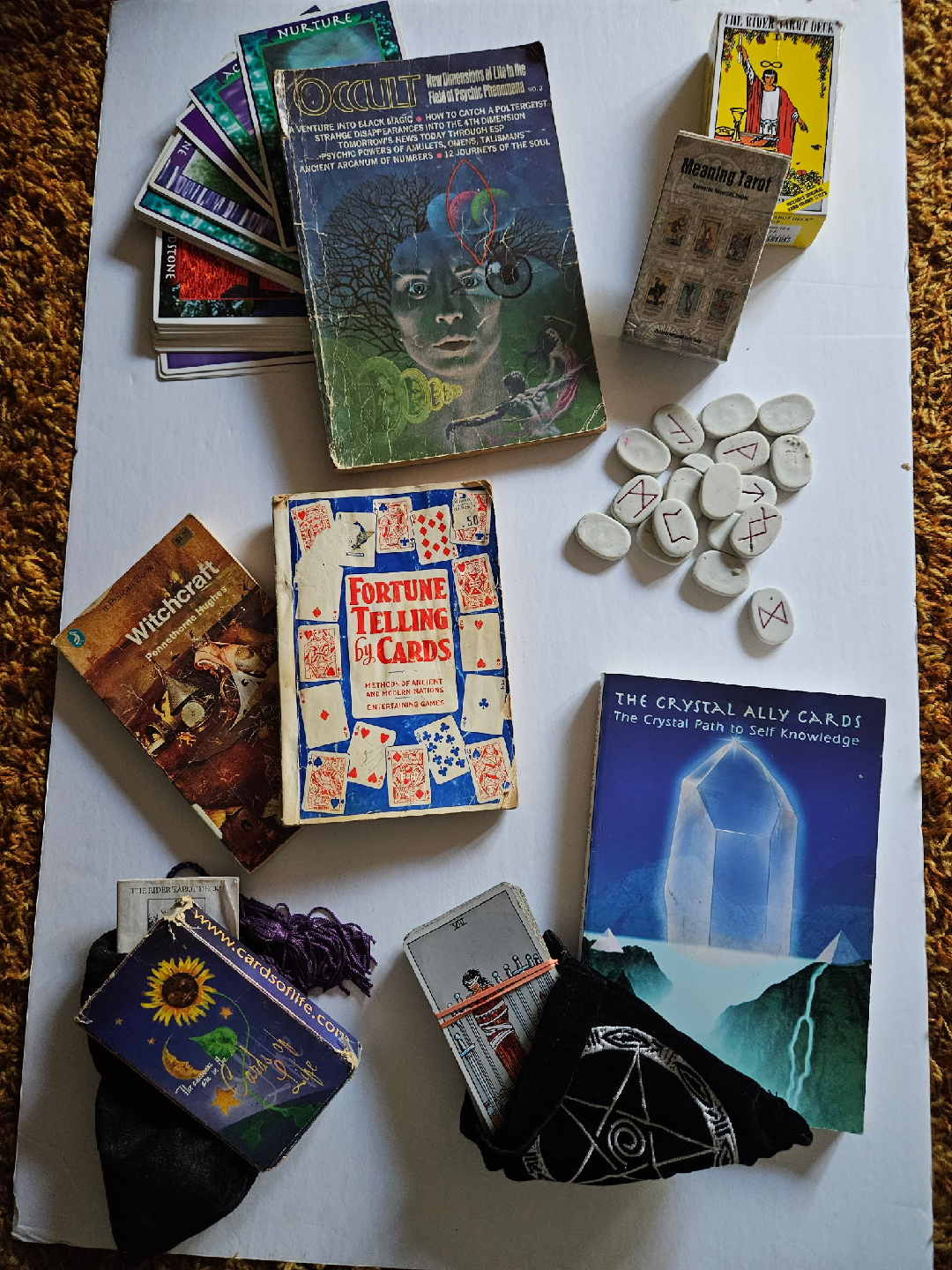 Assorted Tarot Cards, Books, and Runes