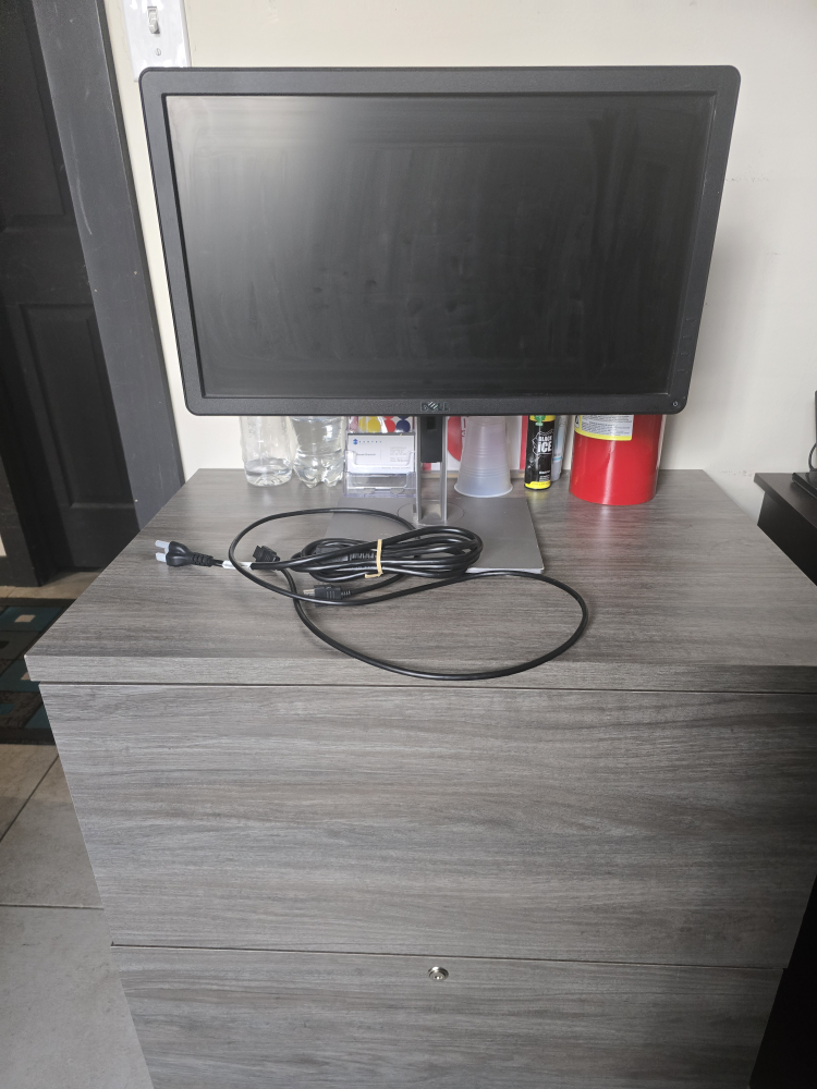 Dell Monitor and Grey Filing Cabinet