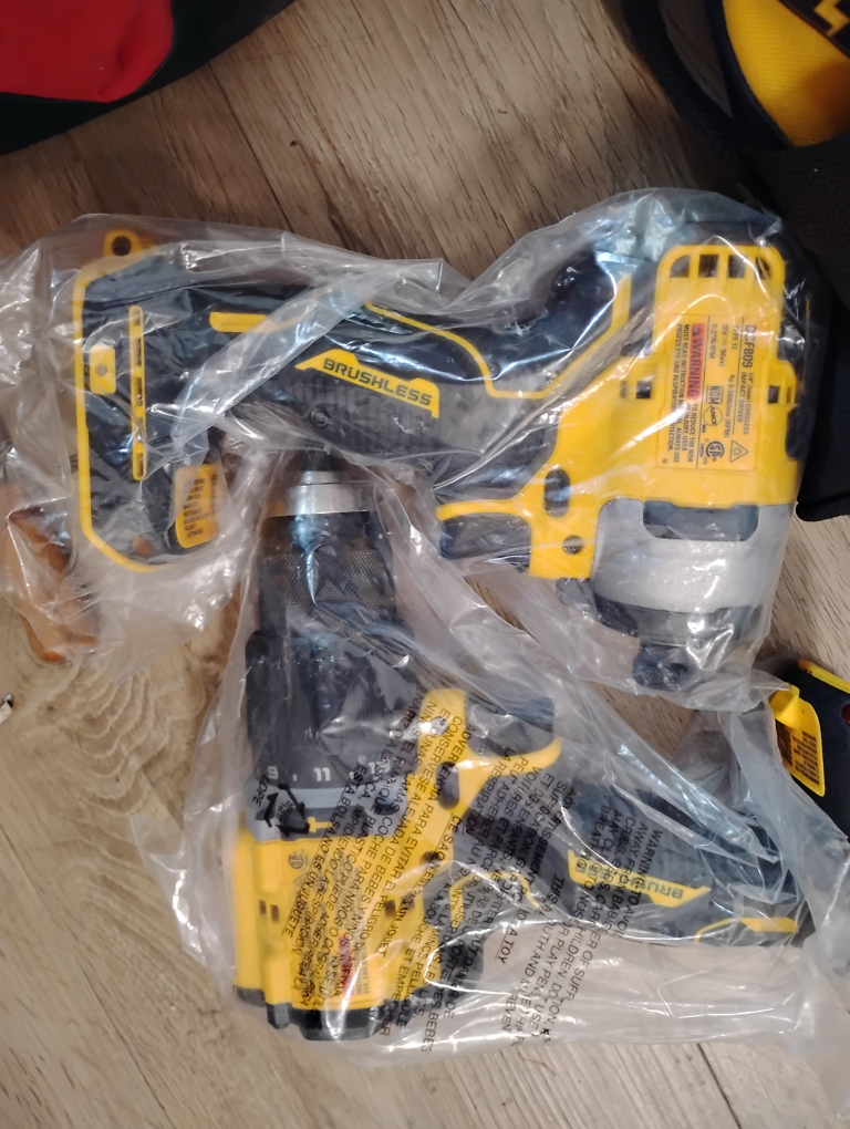 bag of brand new drills battery and charger - photo 5