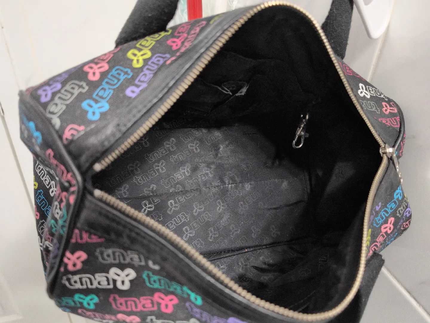 TNA black and colourful logo print bag image indicator(4)