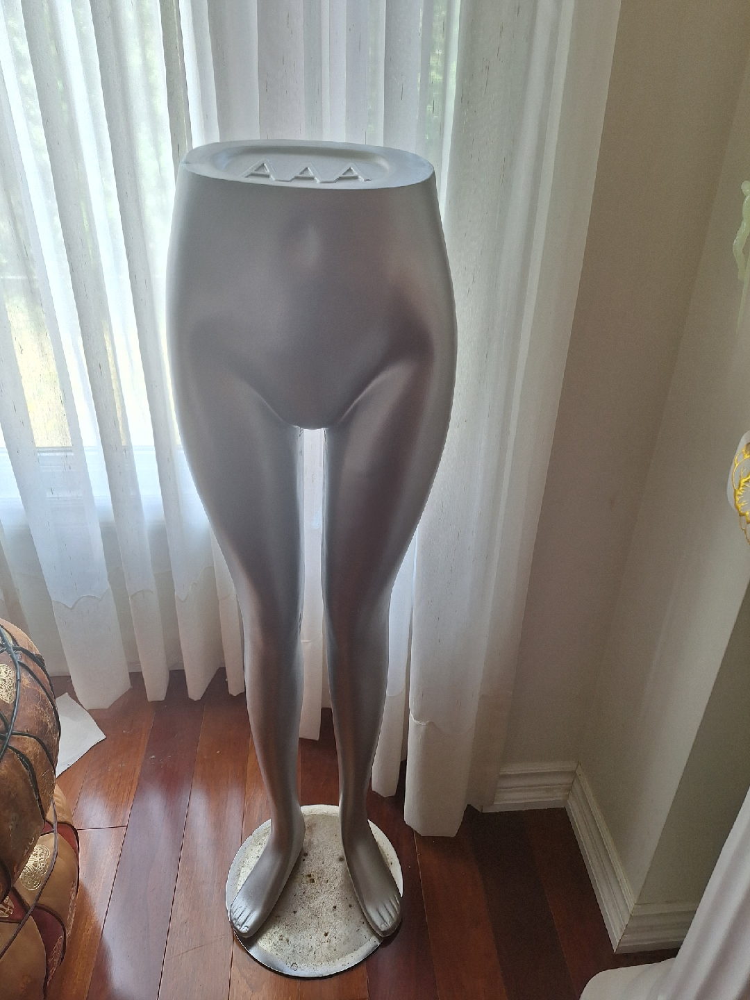 Female silver plastic leg form mannequin