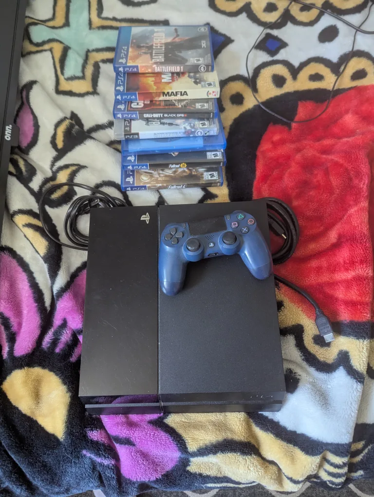 PlayStation 4 with Games and Controller thumbnail