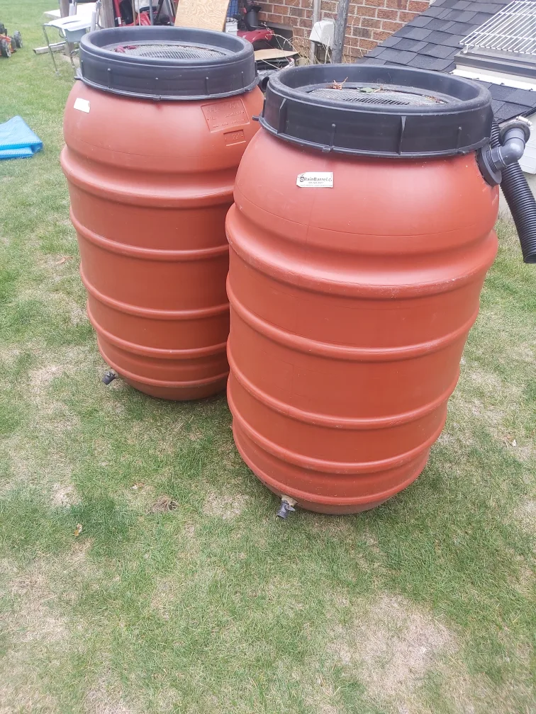 Two Orange Plastic Rain Barrels image indicator(2)