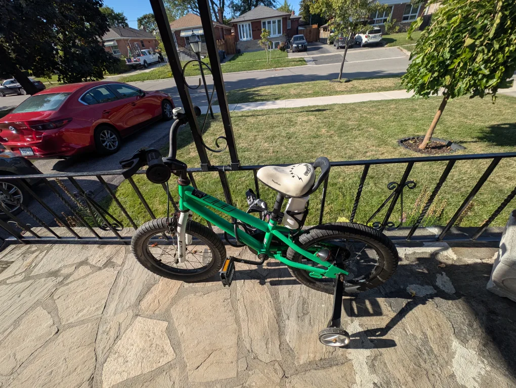 Green kids bike with training wheels image indicator(2)