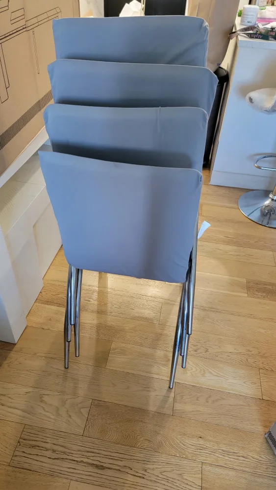 4 White Dining Chairs with Gray Covers image indicator(5)