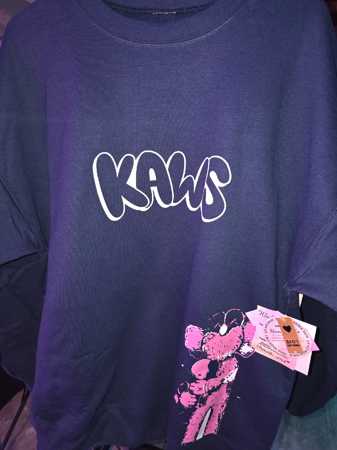 KAWS Crewneck Sweatshirt & Graphic Tee image indicator(4)