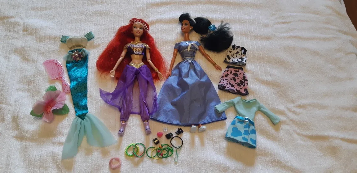 2 Barbie dolls with extra clothes thumbnail