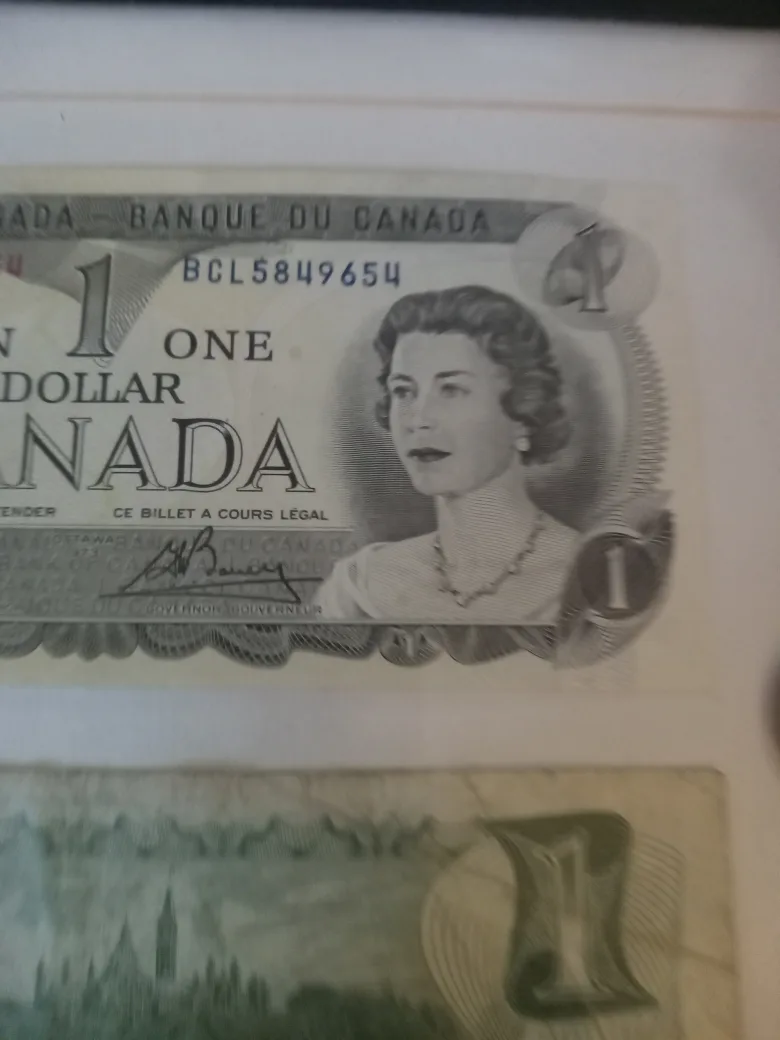Framed Canadian One Dollar Bills & Coin image indicator(6)