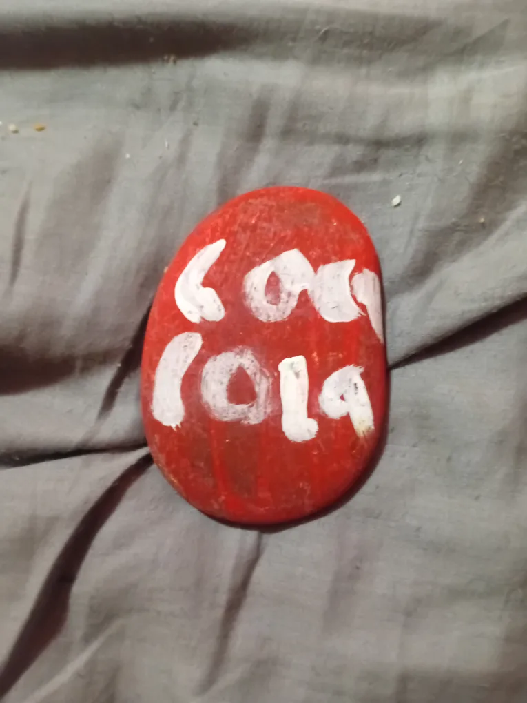 Coca Cola painted rock thumbnail