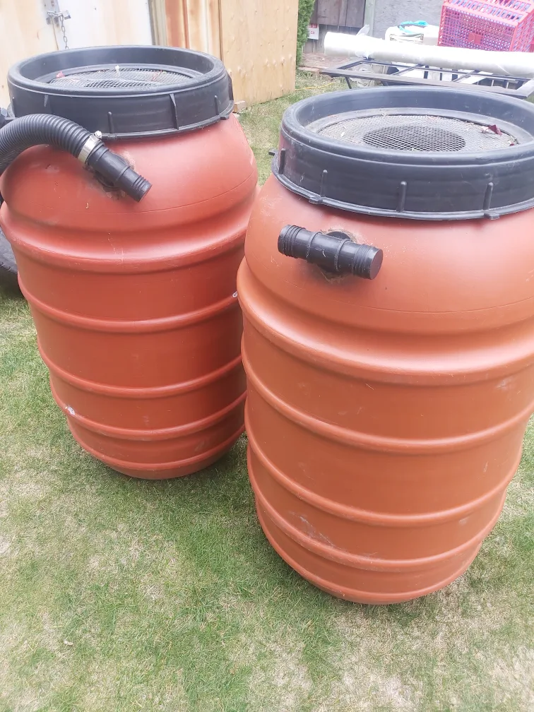 Two Orange Plastic Rain Barrels image indicator(5)
